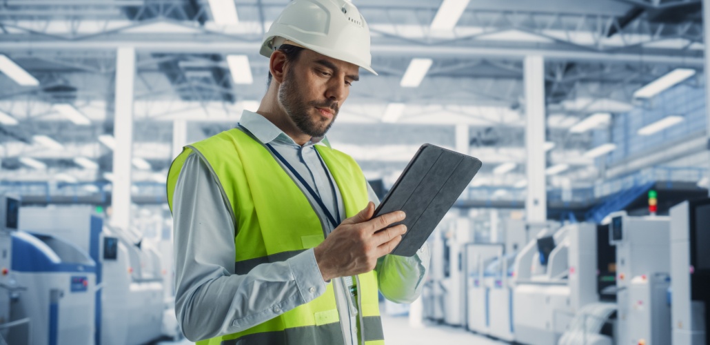 Building a smarter grid through unified data engineer with laptop_Shutterstock_2492758851